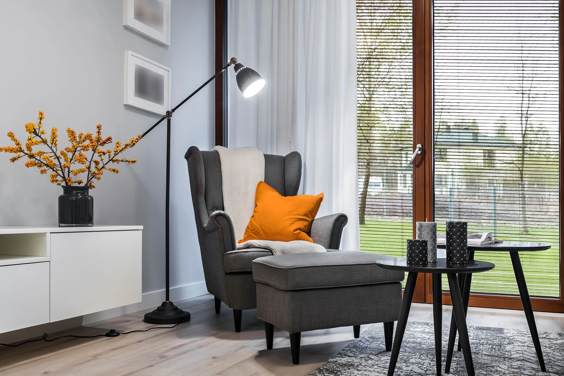 A living room filled with furniture and a lamp.